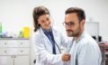 Young,Doctor,Is,Using,A,Stethoscope,Listen,To,The,Heartbeat