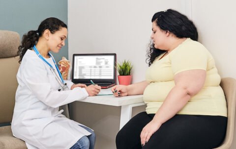 Dietitian consultation. Woman visits nutritionist for treatment obesity